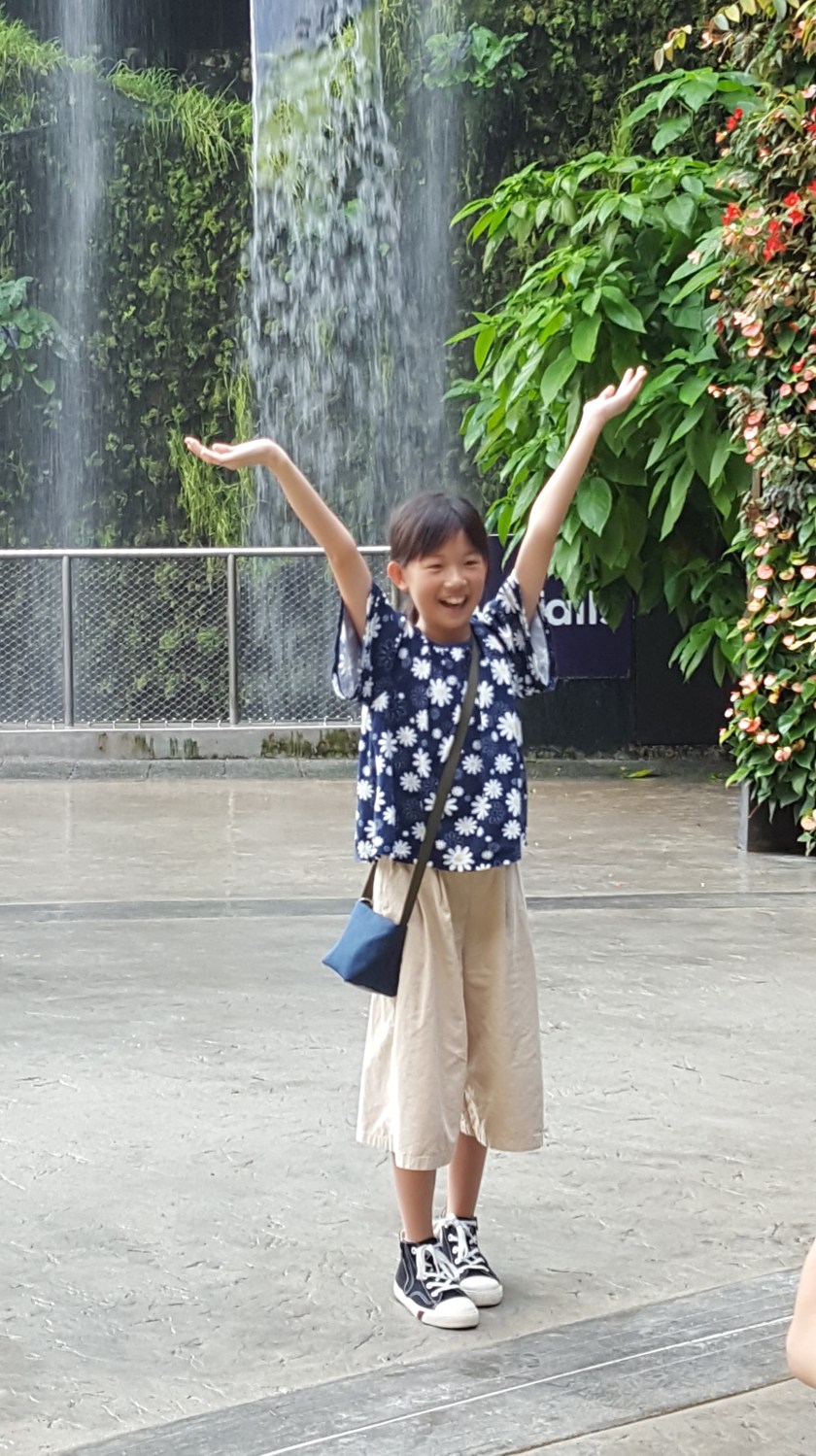 Hands up! Girl at Singapore Botanical Gardens
