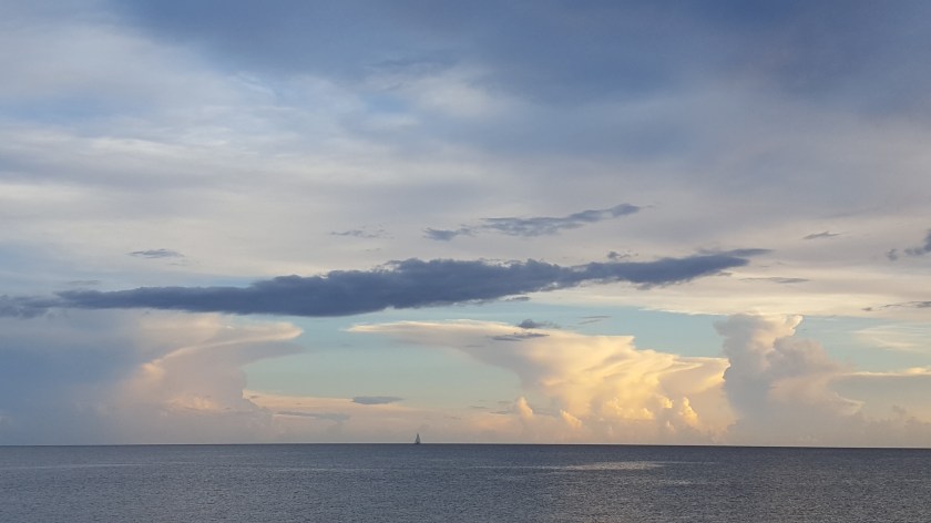 Cloud arms encircling, God holds the world 1