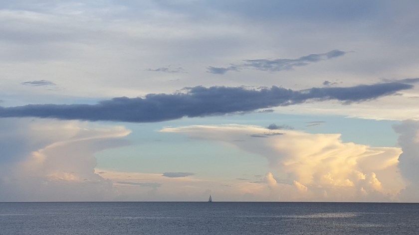 Cloud arms encircling, God holds the world 2