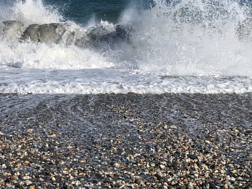 Waves crashing sand, rocks, Western NZ