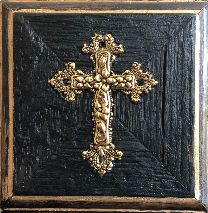 Antique cross on wood