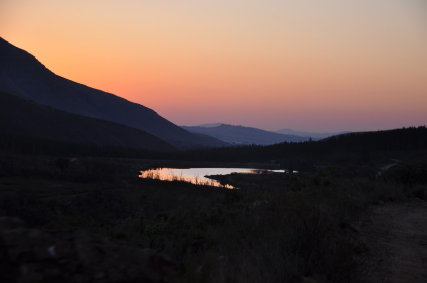 South African sunset in mountains, reflected in water