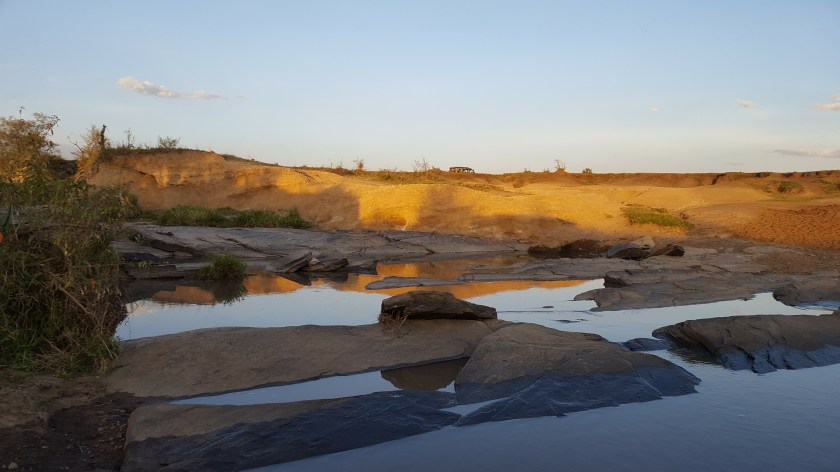 Masai Mara flat rocks reflections