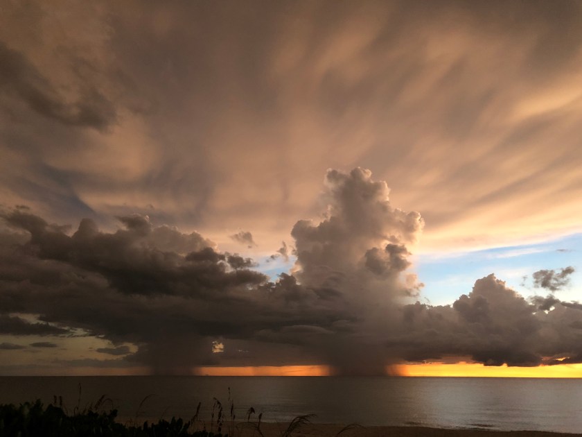 Dramatic clouds w rain at sunset 2, orange horizon