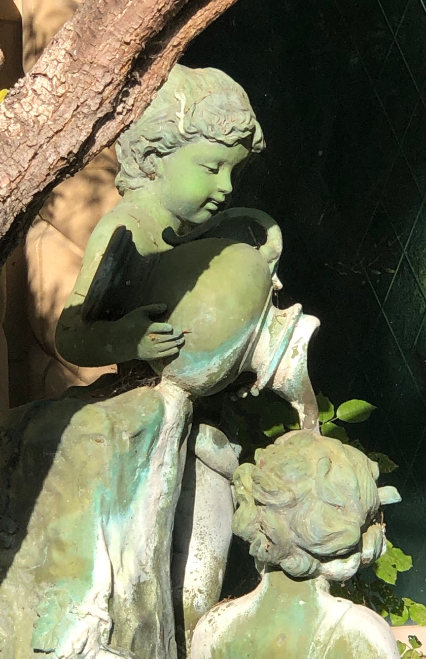 Bronze sculpture of boy pouring water for another, Dana Point, CA