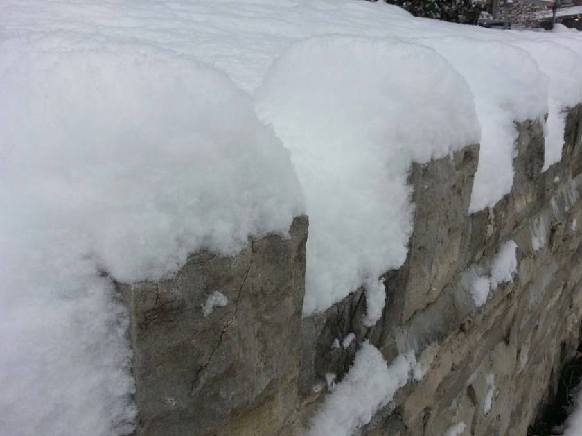 Snow on stone wall, St. Louis