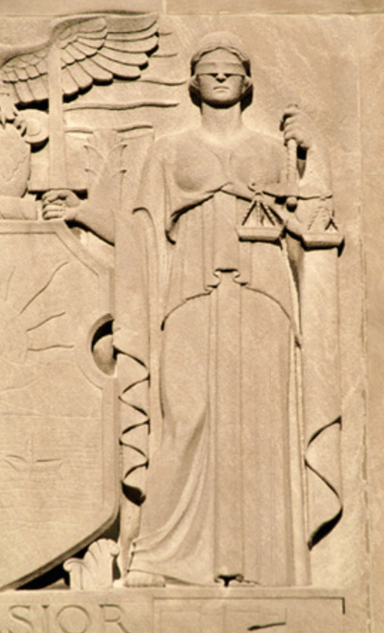 Lady Justice w scales, relief