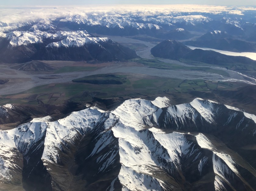 NZ snow-capped mountains, lakes from air